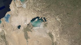 Lake Aral dry up become desert process. Satellite images map time lapse. Global warming problem. Ecology catastrophe aerial view. Climate change concept. Drought, sea water level shrink. Hot weather. - Powered by Shutterstock - Get 15% off with code: PIKWIZARD15