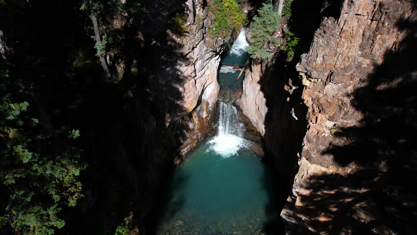 Cascade Creek Falls, Colorado USA, Aerial View of Waterfalls and Natural Pool Under Steep Canyon Cliffs