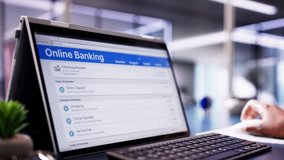 Digital Banking: African American Businesswoman Using Mobile Authentication for Financial Transfer on Laptop and Tablet Screens - Powered by Shutterstock - Get 15% off with code: PIKWIZARD15