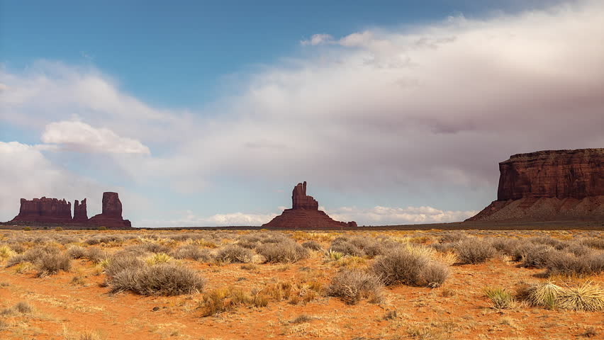 West Mitten Butte, East Mitten Butte, and Merrick Butte At Monument Valley In Arizona, USA. timelapse
