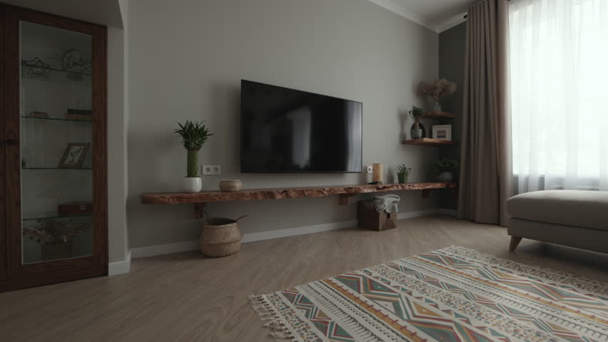 Dolly shot.Home interior design detail of Modern clean living room with soft and cozy daylight, natural wood in interior Scandi style, home sweet home background 