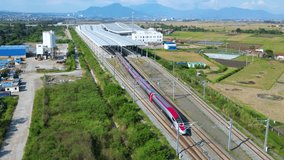 Established Aerial View of Whoosh High Speed Train Departs from Tegalluar Station, Gedebage, East Bandung, Indonesia - Powered by Shutterstock - Get 15% off with code: PIKWIZARD15