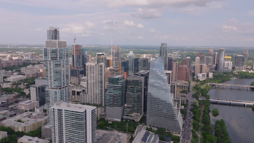 Aerial view of downtown Austin, Texas, showcasing the modern skyline and Colorado River, creating a stunning urban landscape