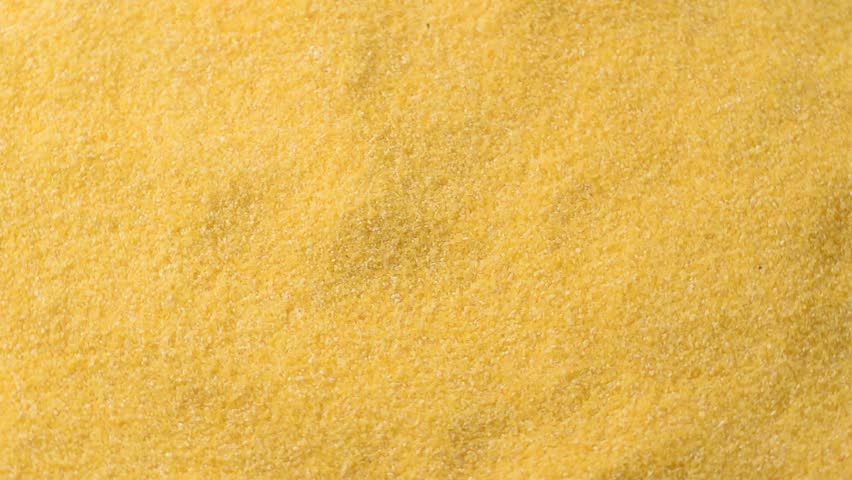Pile of cornmeal,macro close-up,rotating video.