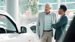Car dealership, negotiation or retail with customer and salesman on showroom floor for choice or option. Advice, consulting and decision making with mature trader talking to client for vehicle deal - Powered by Shutterstock - Get 15% off with code: PIKWIZARD15