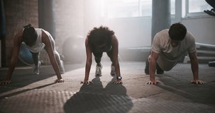 Gym, push ups and friends with endurance for fitness, exercise and teamwork with support. Workout people, man and women for collaboration in training center for wellness, health and physical activity - Powered by Shutterstock - Get 15% off with code: PIKWIZARD15