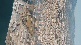 Vertical video. Palermo, Sicily, Italy. Embankment and port. Panorama of the city. In the foreground is Castello a Mare and Piazza XIII Vittime, Aerial View
