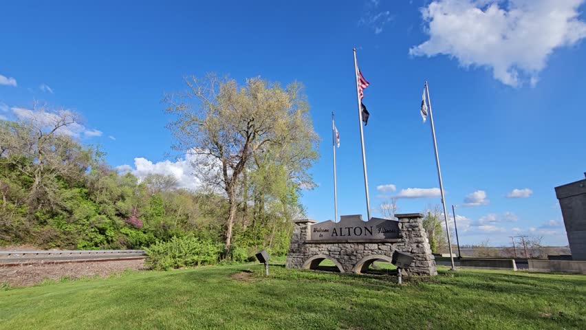 Welcome to Alton Illinois Signage with American Flags Along the Great River Road, Super Wide Low Angle Shot.