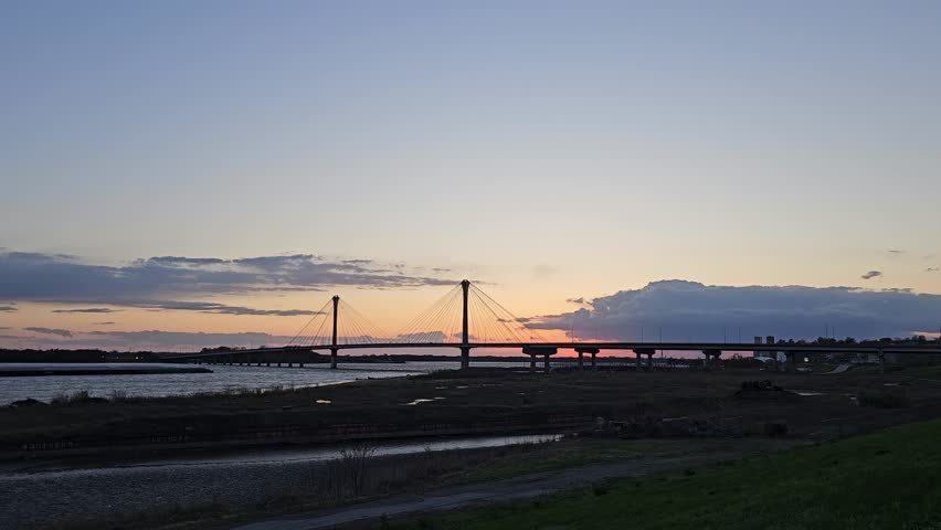 Clark Bridge Silhouette in Alton with Sunset Overlooking the Mississippi River, Illinois, USA. Super Wide Angle.