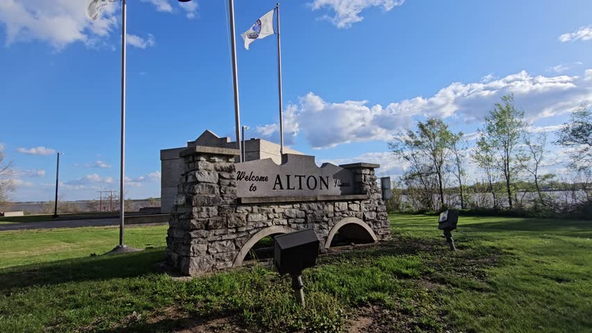 Welcome to Alton Illinois Sign with Slow Motion Panning Shot Against Blue Skies, USA.
