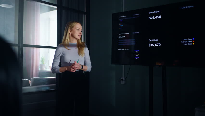 Portrait Of Young Adult Caucasian Businesswoman Speaking In Business Meeting In Office