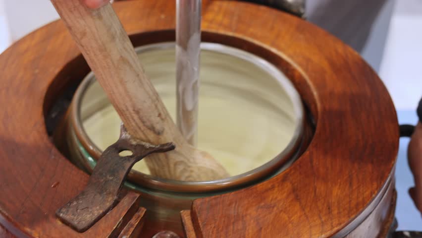 Artisan Production of Fresh Vanilla Ice Cream in Manually Rotated Container