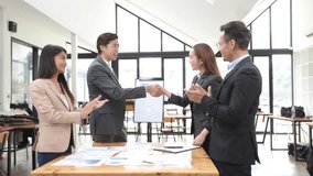 Excited Asian business team celebrating success in office, - Powered by Shutterstock - Get 15% off with code: PIKWIZARD15