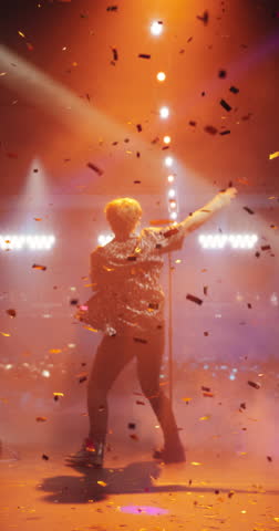 Vertical Screen: Energetic Rock Band Performing on a Nightclub Stage with Dynamic Lights and Special Effects. Rock Music Artists Creating a Unique Show Experience With Powerful Alternative Music