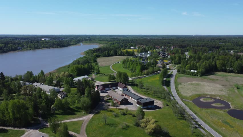 Low flyover of Lake Tuusula farmhouse in vibrant Finland near Kerava