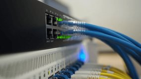 hand man touch lan cable with fiber optic cable connected use for network product concept. closeup photo. - Powered by Shutterstock - Get 15% off with code: PIKWIZARD15