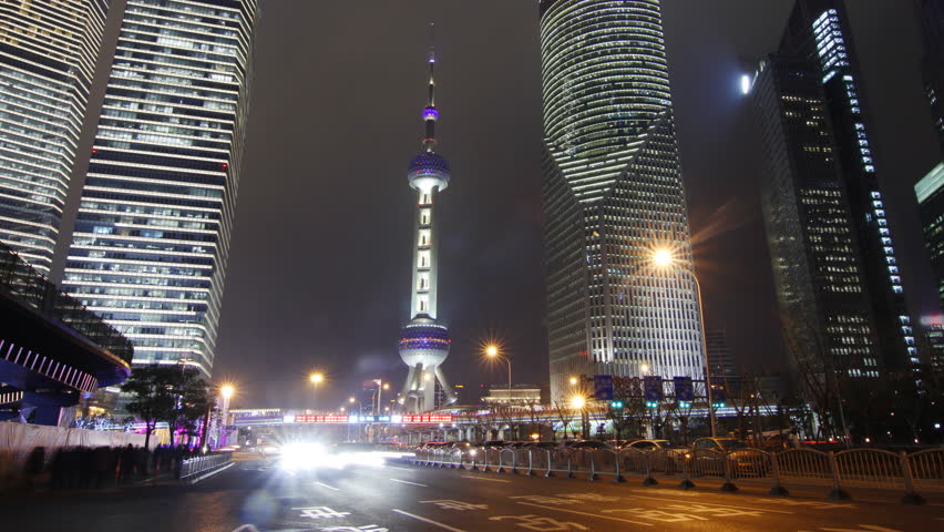 Shanghai landmark and city traffic at night - Shanghai, China.