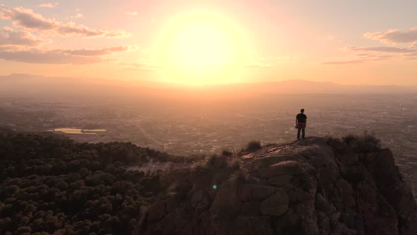 Man rock climbing aerial view of sportsman rapelling mountain in La Panocha, el Valle Murcia, Spain woman rapel down a mountain climbing a big rock