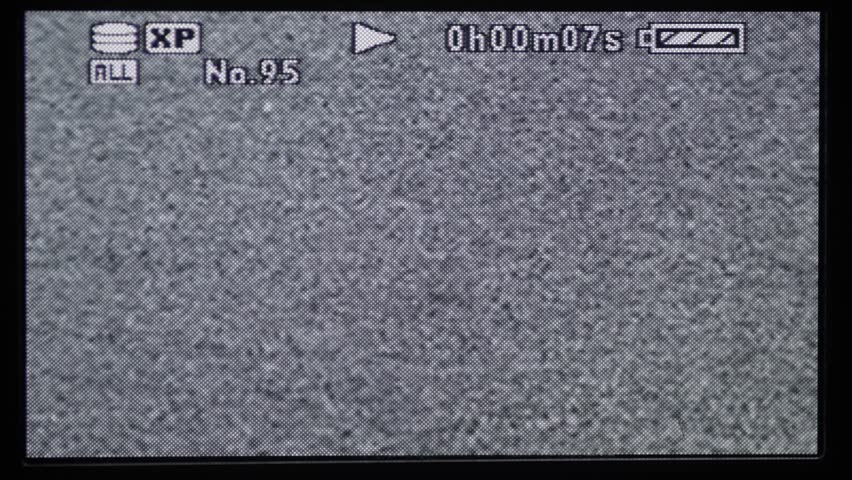 blank and retro looking SD digicam lcd backside monitor screen with blank flickering pixel video playback signal.
