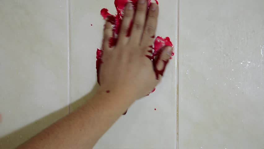Hand in blood on a wall