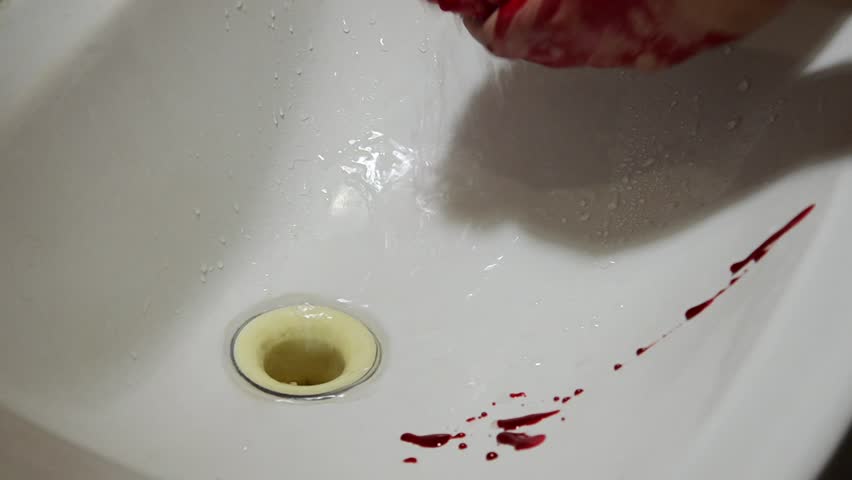 Washing blood off hands in the sink