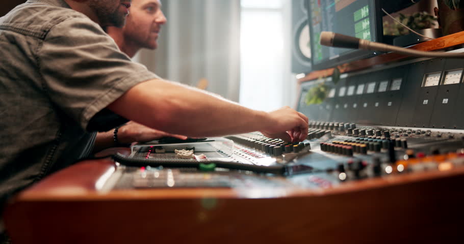 Studio, hands and producer with music equipment for volume level, frequency mode and control. People, sound engineer and audio mixer for track record, consistency and creativity with workstation