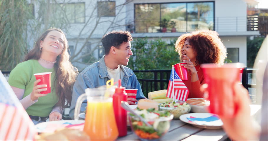 Friends, celebration and meal on independence day, outside and lunch with American flag for culture party. National holiday, tradition and USA country pride, people and food or discussion in garden