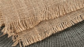 Close-up shot of burlap fabric with frayed edges, showcasing the natural texture and weave. Rotation - Powered by Shutterstock - Get 15% off with code: PIKWIZARD15