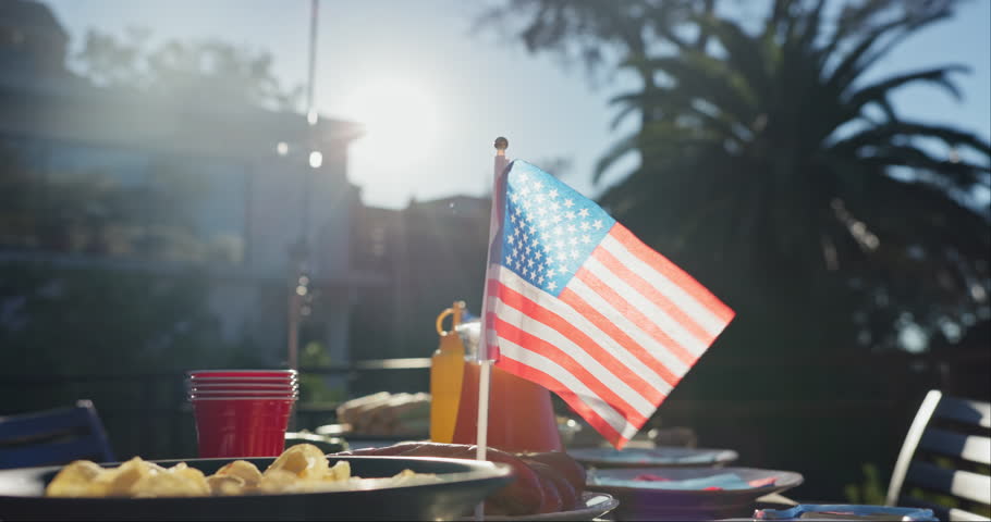 USA, flag and backyard with holiday party at independence day celebration of culture. American, picnic and freedom on vacation event in summer with beer, bbq or national pride for country victory