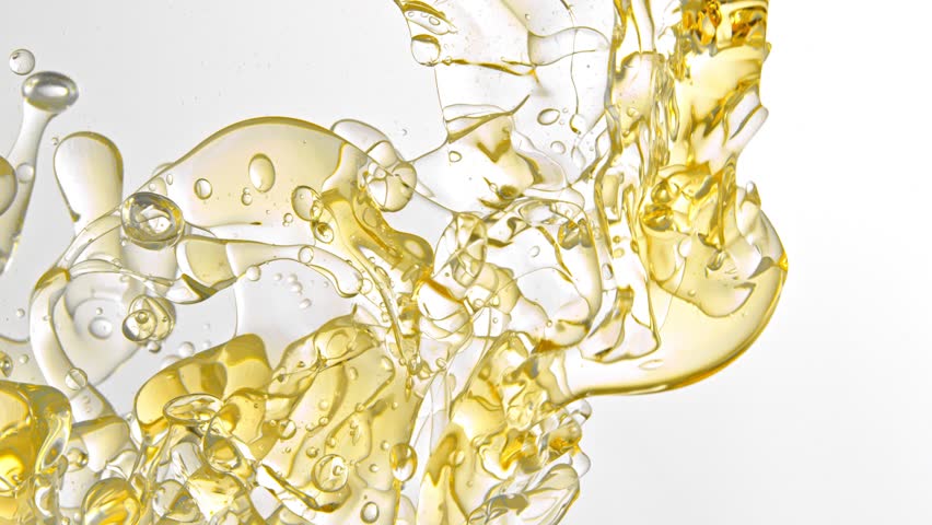 Super Slow Motion Shot of Pouring Oil into Water on White Background at 1000fps.
