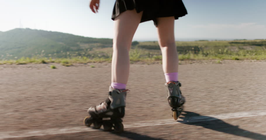 Roller skating, skater rolling, side view on legs
