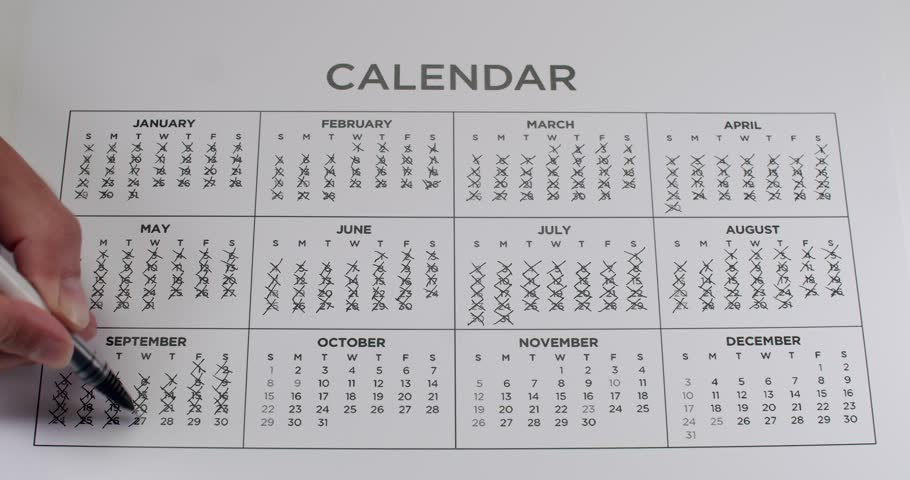 A calendar year with all days marked off as time passes in this time-lapse video. Great for concepts about time, deadlines, countdowns, and the year passing. Crossing Out Dates On Calendar