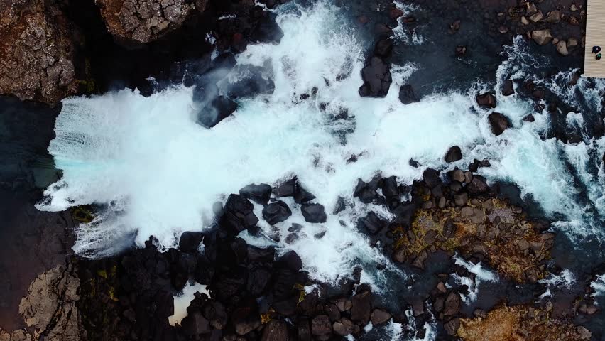 Aerial view of Oxarafoss waterfall in Thingvellir National Park, Iceland. See the Oxara River and the tectonic plates of America and Eurasia. Stunning natural scenery and geological wonder.