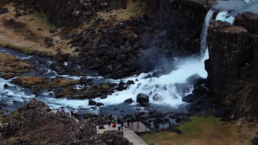 Aerial view of Oxarafoss waterfall in Thingvellir National Park, Iceland. See the Oxara River and the tectonic plates of America and Eurasia. Stunning natural scenery and geological wonder.