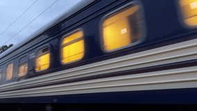 Twilight Express: Illuminated Train Journey at Dusk | Close-up Wide-Shot of Speeding Intercity Locomotive in Motion - Powered by Shutterstock - Get 15% off with code: PIKWIZARD15