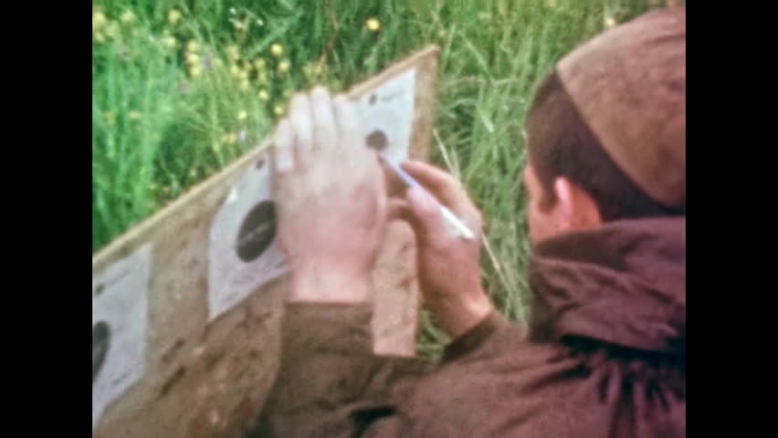 Soldier checking firing on shooting range targets, outdoors. Shooting practice. Soviet soldier shooter in uniform in military training, watch bullet hit target. Vintage color film. Retro 1980s archive