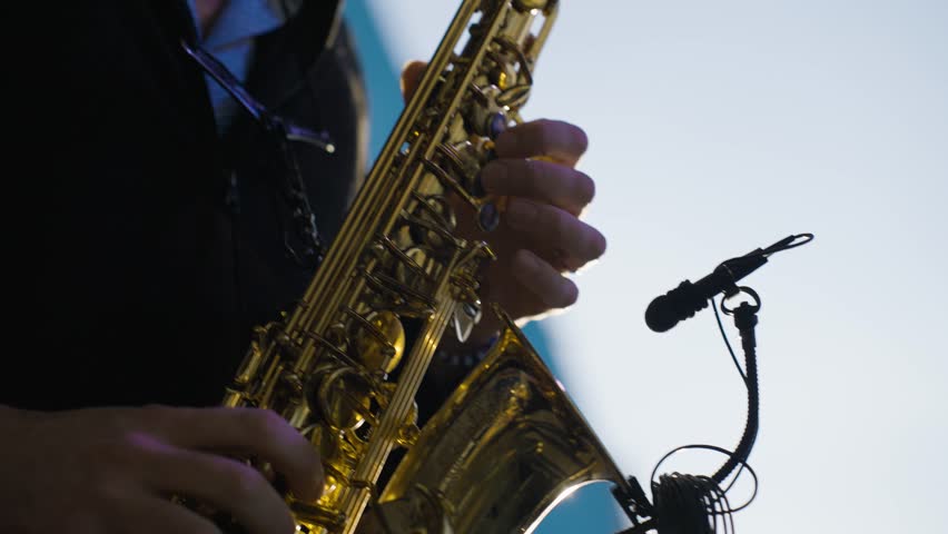 saxophone playing detail, slow motion