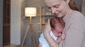 Calm newborn is sleeping peacefully in his mother hands woman gently kissing infant head female enjoying first days of her motherhood - Powered by Shutterstock - Get 15% off with code: PIKWIZARD15