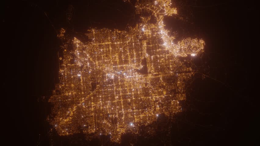 Las Vegas (Nevada, USA) top view at night. View on modern city from satellite. Camera is zooming in, rotating counterclockwise. Vertical video. The north is on the left side