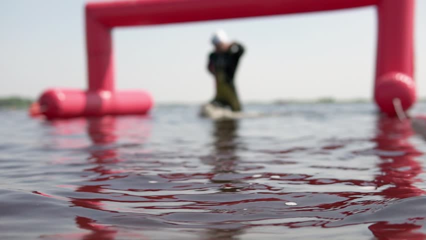 Triathletes finish at the swim distance and move on to the bike stage. Professional training for swimmers, open water triathlon competitions.