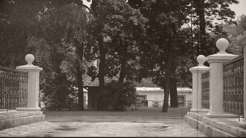 A horse-drawn carriage driver drives up to the palace with passengers from the old era