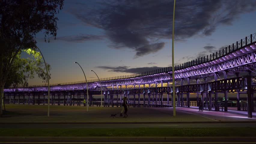 Look on Huelva Port with yellow cranes seen from historical Pier on Rio Tinto Spain