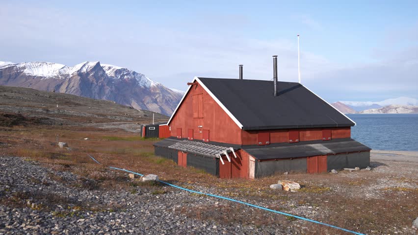 Buildings on Coast of Greenland and Kong Oscar Fjord on Sunny Summer Day