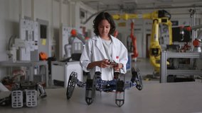 Curious boy interested in robotics, controlling robot's actions. Basic of science, technology, engineering in elementary schools. Future scientists. - Powered by Shutterstock - Get 15% off with code: PIKWIZARD15