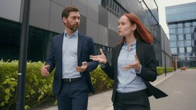 Businesspeople colleagues discussing marketing startup project ideas strategy cooperation business coworkers discuss deal entrepreneurs talking walking in city partnership businessman businesswoman - Powered by Shutterstock - Get 15% off with code: PIKWIZARD15