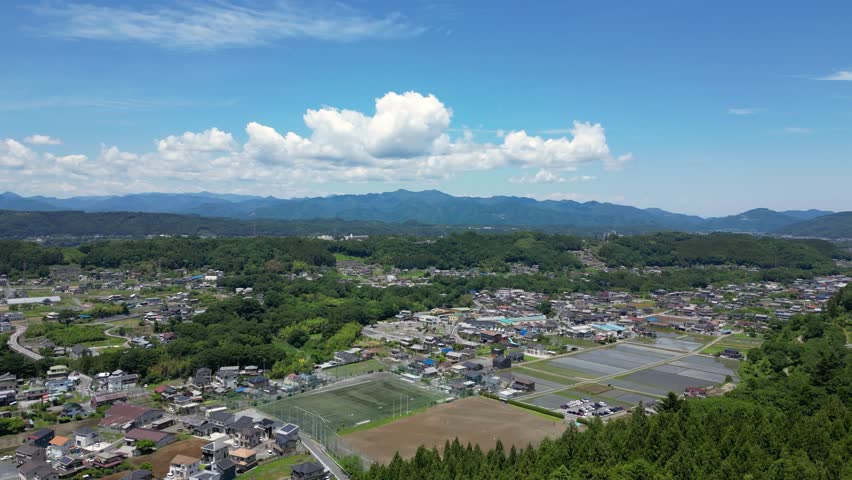 Drone view of rural Japanese landscape on clear summer day