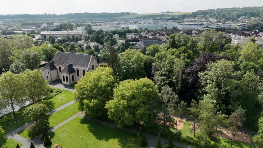 Aerial view of Coulommiers with Parc des Capucins, highlighting lush greenery and historic architecture, France