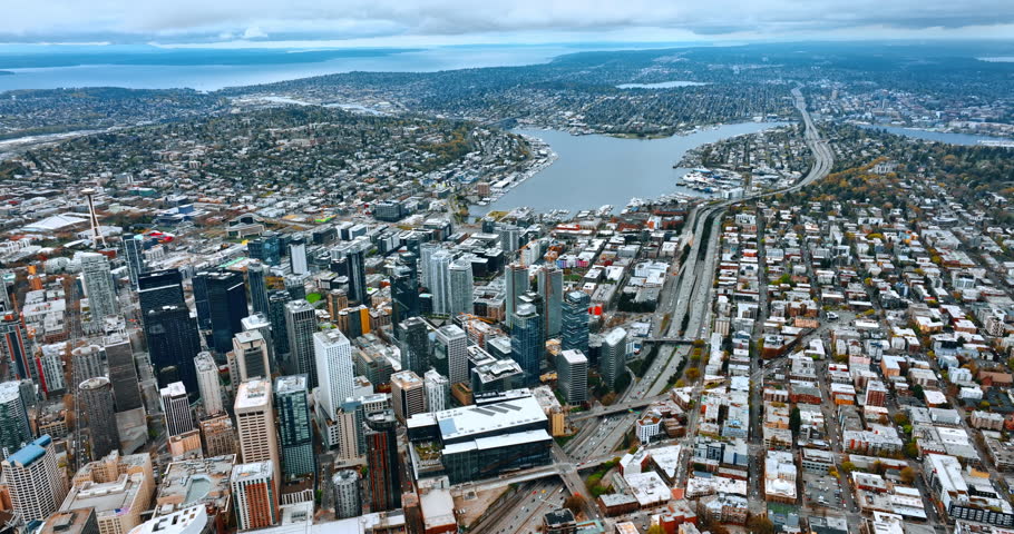 Lake Union in the scenery of modern Seattle, Washington, the USA. Aerial perspective on the city panorama under cloudy sky.