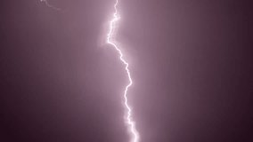 An epic slow-motion footage of a lightning strike illuminating the sky. Perfect for themes of power, nature, and dramatic weather, ideal for environmental and cinematic advertisements.  - Powered by Shutterstock - Get 15% off with code: PIKWIZARD15