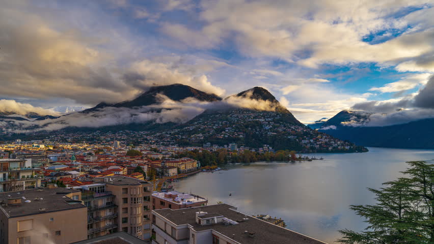 Lugano, Switzerland on Lake Lugano at dusk.